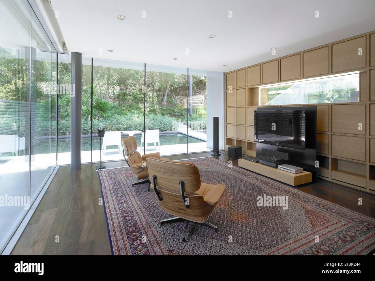 Two Eames chairs face television, Lakeshore View, Sentosa Cove