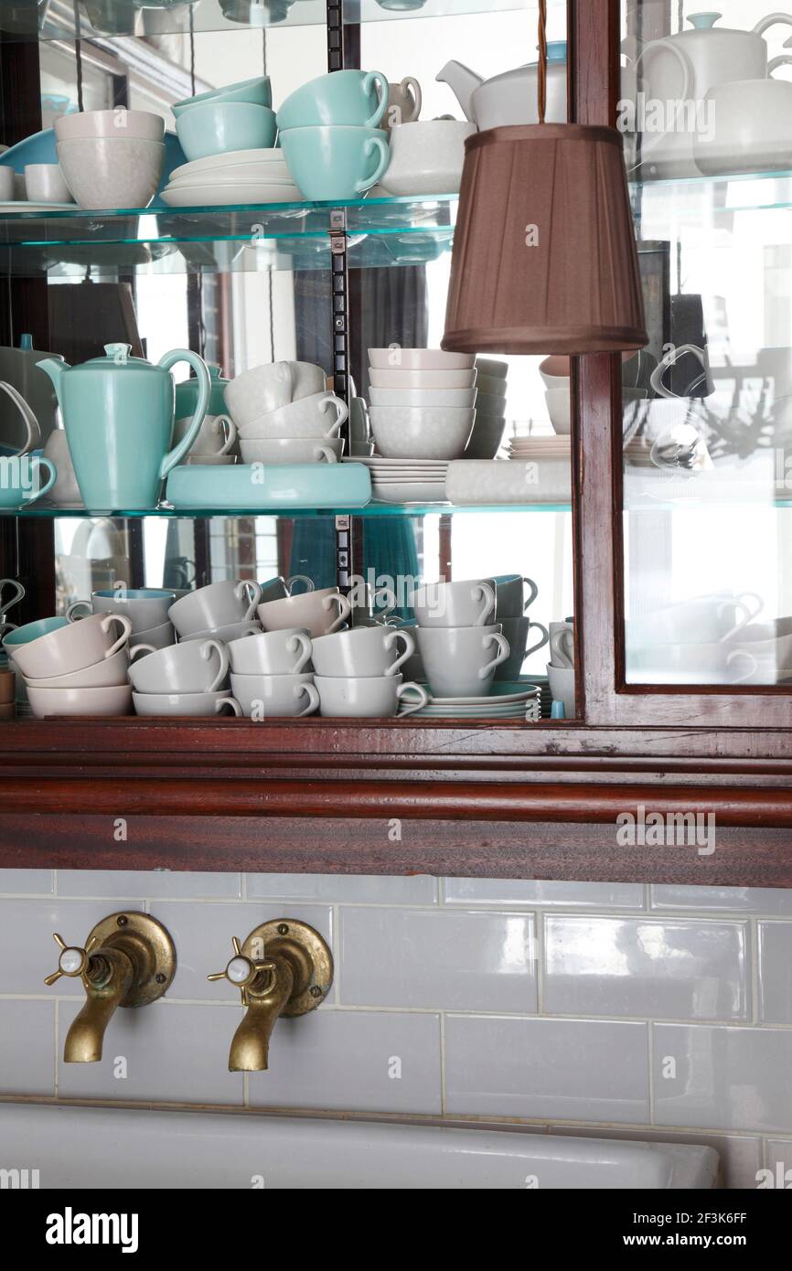 Collection of turquoise and cream Poole pottery teacups and saucers
