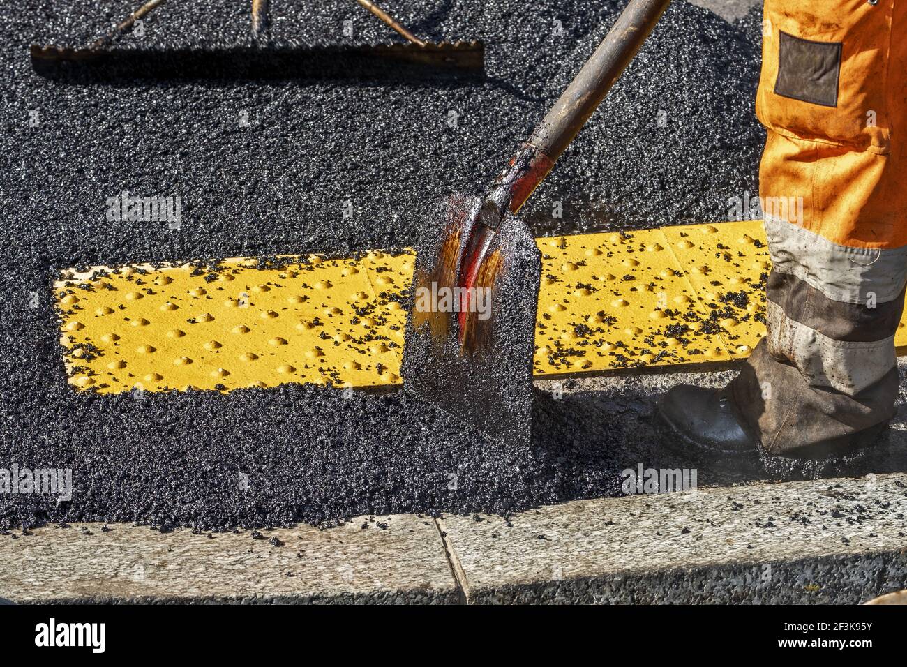 Paving the road with porous asphalt for traffic noise reduction in Geneva, switzerland Stock Photo