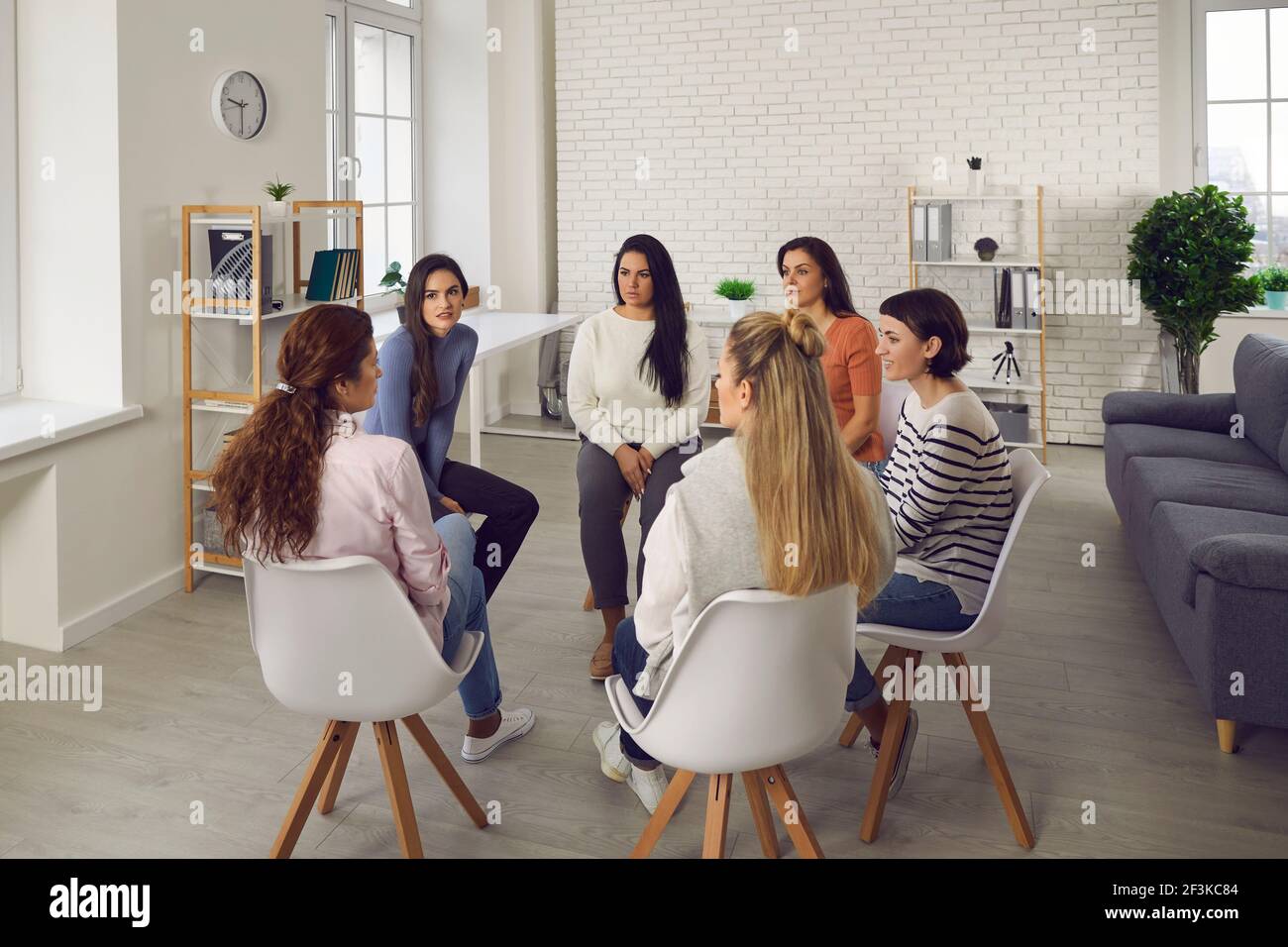Women telling their stories, discussing life situations, working out solutions together Stock Photo