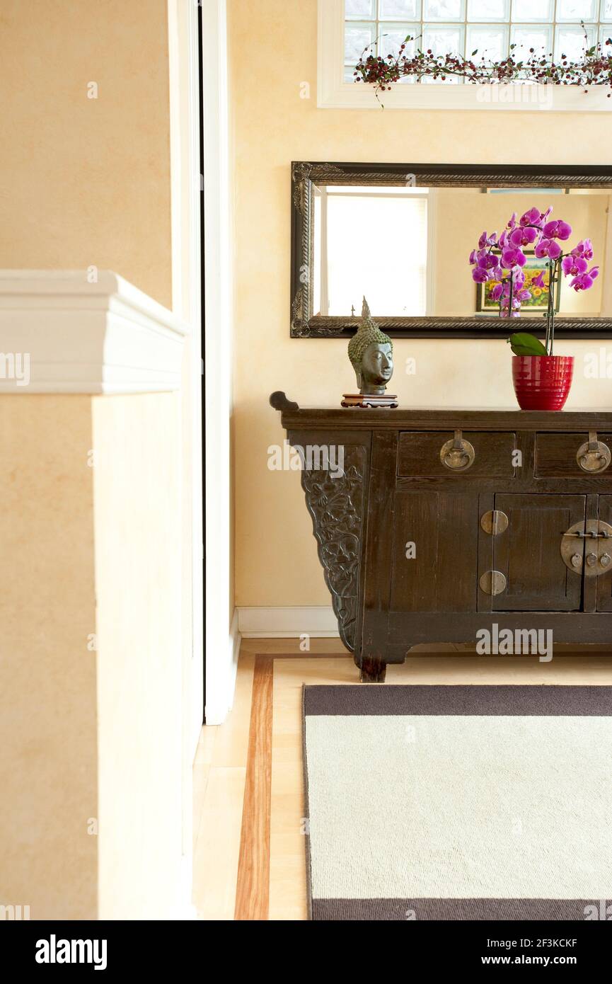 Brightly lit entrance with walkway and Asian Accents Stock Photo
