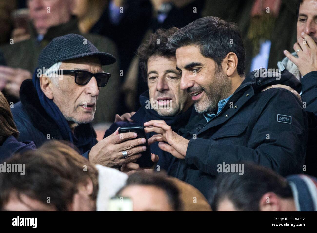 French actor and comedian Ary Abittan (R) is seen with French actor Gerard Darmon (L) and French singer Patrick Bruel (C) during the UEFA Champions League, Group B, football match between Paris Saint-Germain and RSC Anderlecht on October 31, 2017 at Parc des Princes stadium in Paris, France - Photo Geoffroy Van Der Hasselt / DPPI Stock Photo