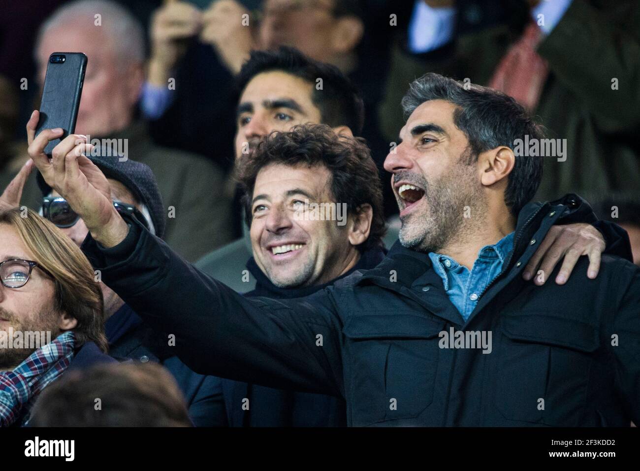 French actor and comedian Ary Abittan (R) is seen taking a picture with French singer Patrick Bruel during the UEFA Champions League, Group B, football match between Paris Saint-Germain and RSC Anderlecht on October 31, 2017 at Parc des Princes stadium in Paris, France - Photo Geoffroy Van Der Hasselt / DPPI Stock Photo