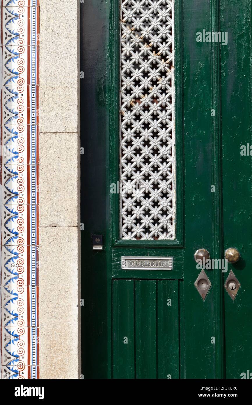 Azulejos tiles provide a decorative edge to a traditional doorway in Ilhavo, Beiras Litoral, Portugal, Stock Photo