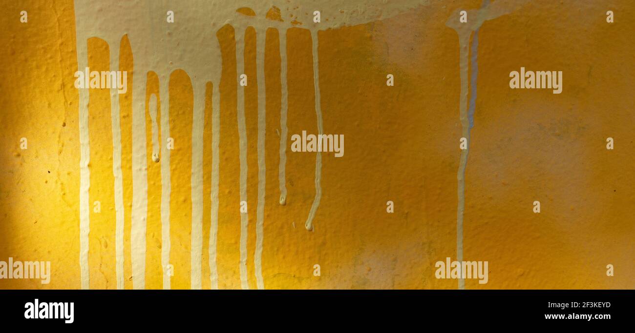 Yellow paint drip wall texture hi-res stock photography and images - Alamy
