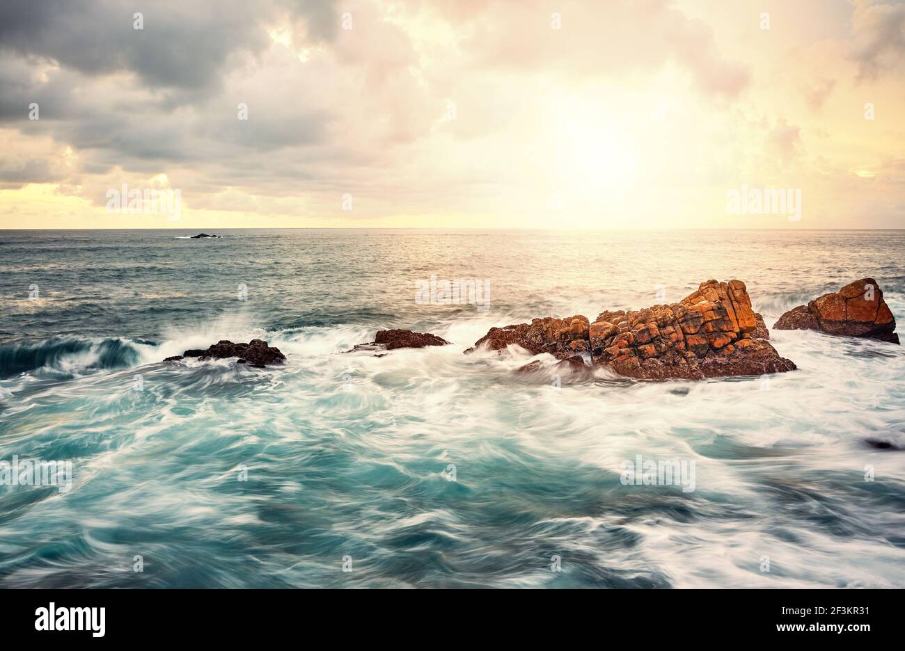 Sea Rocks Sun Set Rocks in a sea at sunset, long exposure picture Stock Photo - Alamy