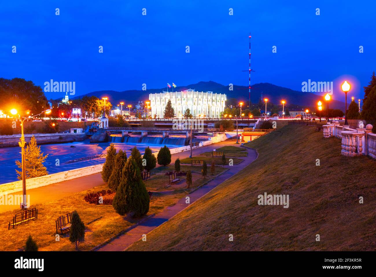 City administration building at the Terek river embankment in the centre of Vladikavkaz city, North Ossetia Alania, Russia at night Stock Photo