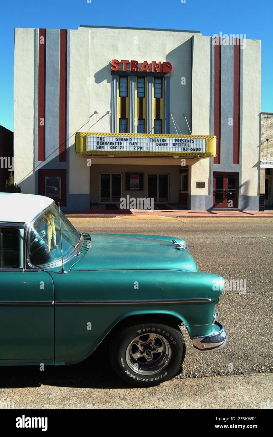 Vintage car in front of oldfashioned theatre, Jennings, Louisiana, USA