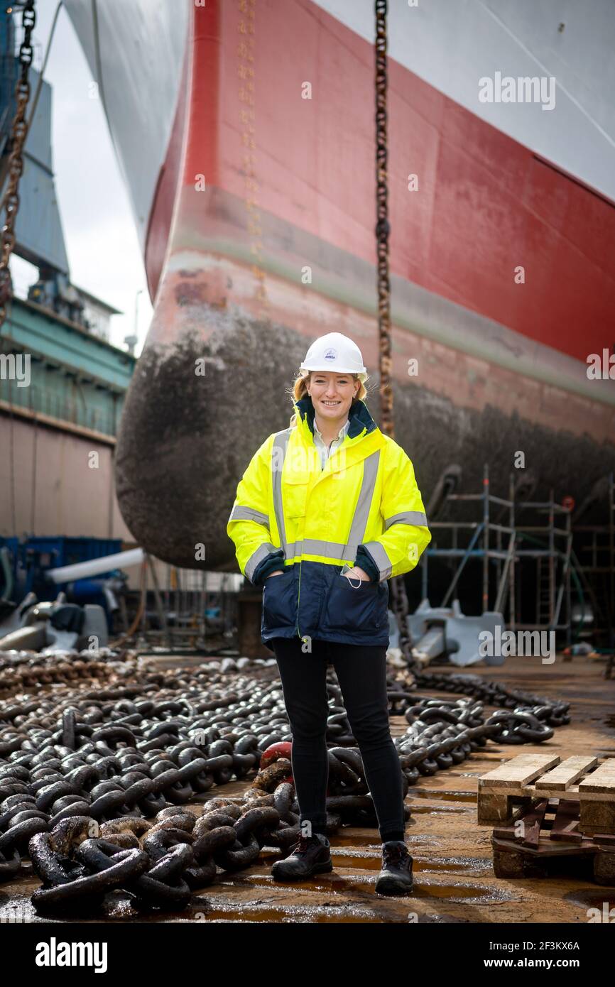 17 March 2021, Bremen, Bremerhaven: Ann-Kathrin Cornelius, Managing  Director of Cap San Diego Betriebsgesellschaft, stands in front of the  ship. The almost 60-year-old Hamburg museum ship is undergoing the ship's  MOT at