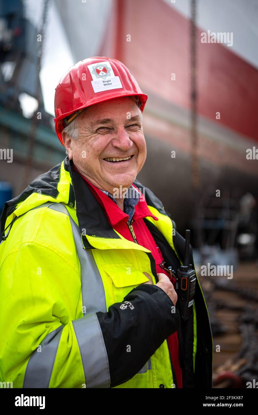 17 March 2021, Bremen, Bremerhaven: Birger Möller, captain of the "Cap San  Diego", stands in front of the ship. The almost 60-year-old Hamburg museum  ship is undergoing the ship's MOT at the