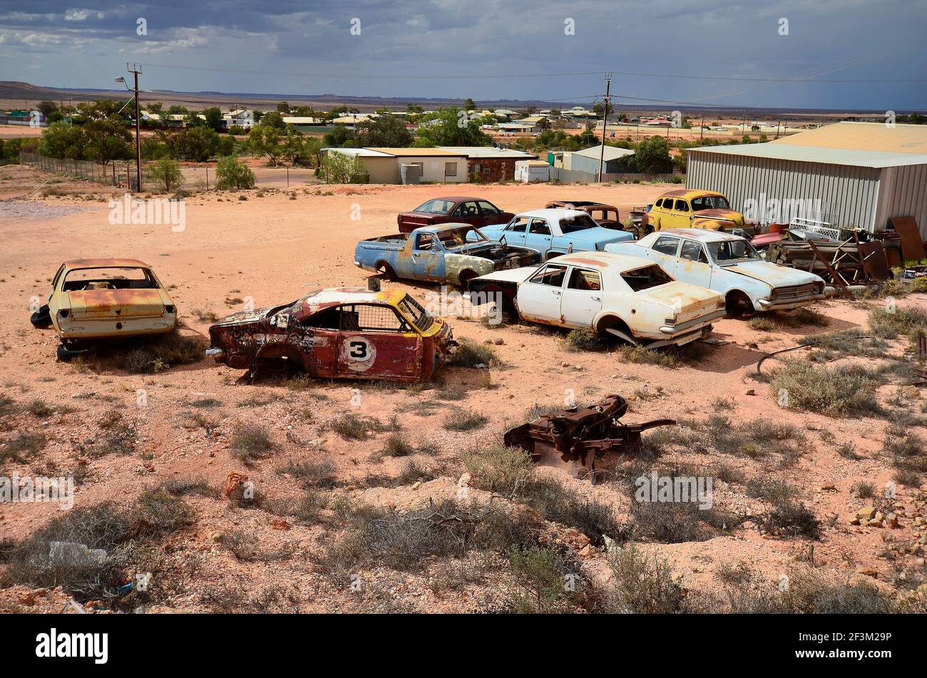 Australia, dump area with wrecked cars in Coober Pedy, Stock Photo