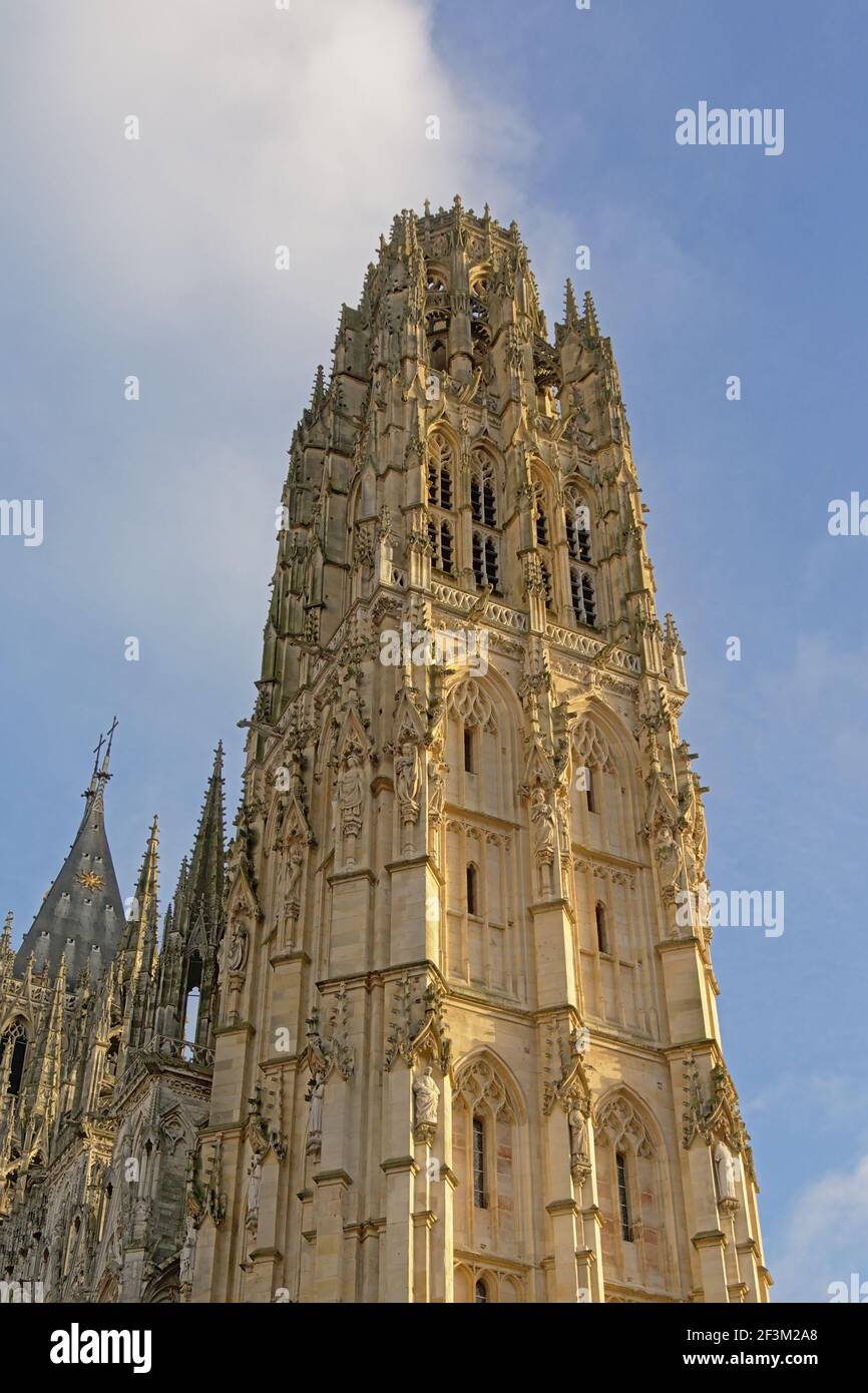 Ornate gothic tower of the cathedral of Rouen, France, with statues of ...