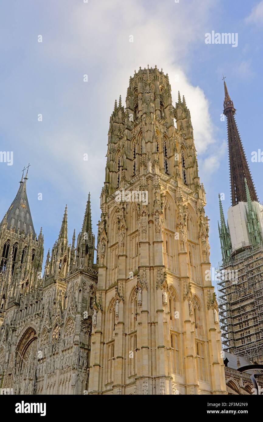 Ornate gothic tower of the cathedral of Rouen, France, with statues of ...