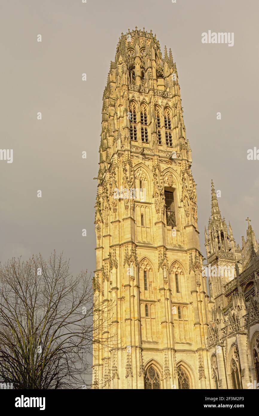 Ornate gothic tower of the cathedral of Rouen, France, with statues of ...