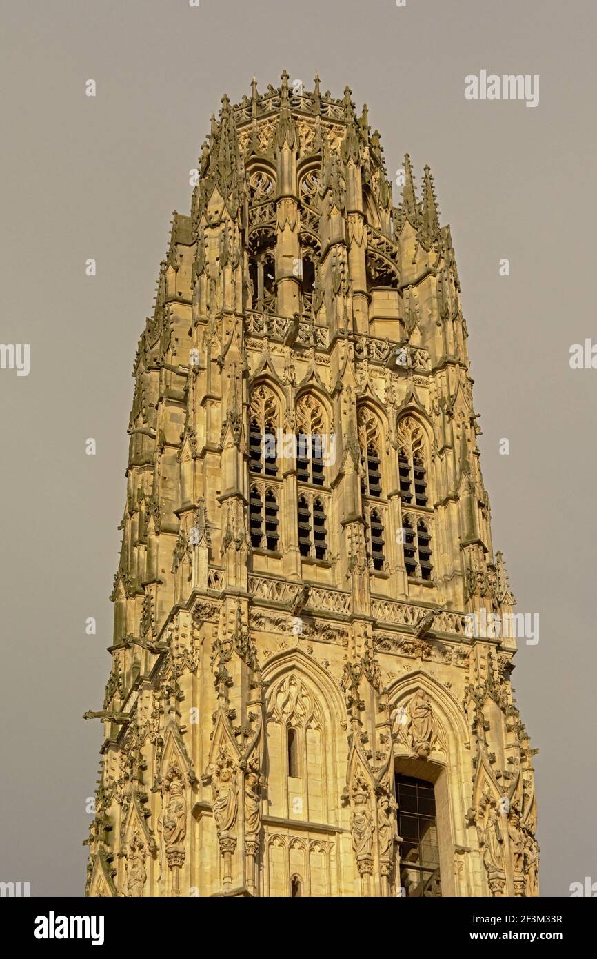 Ornate gothic tower of the cathedral of Rouen, France, with statues of ...