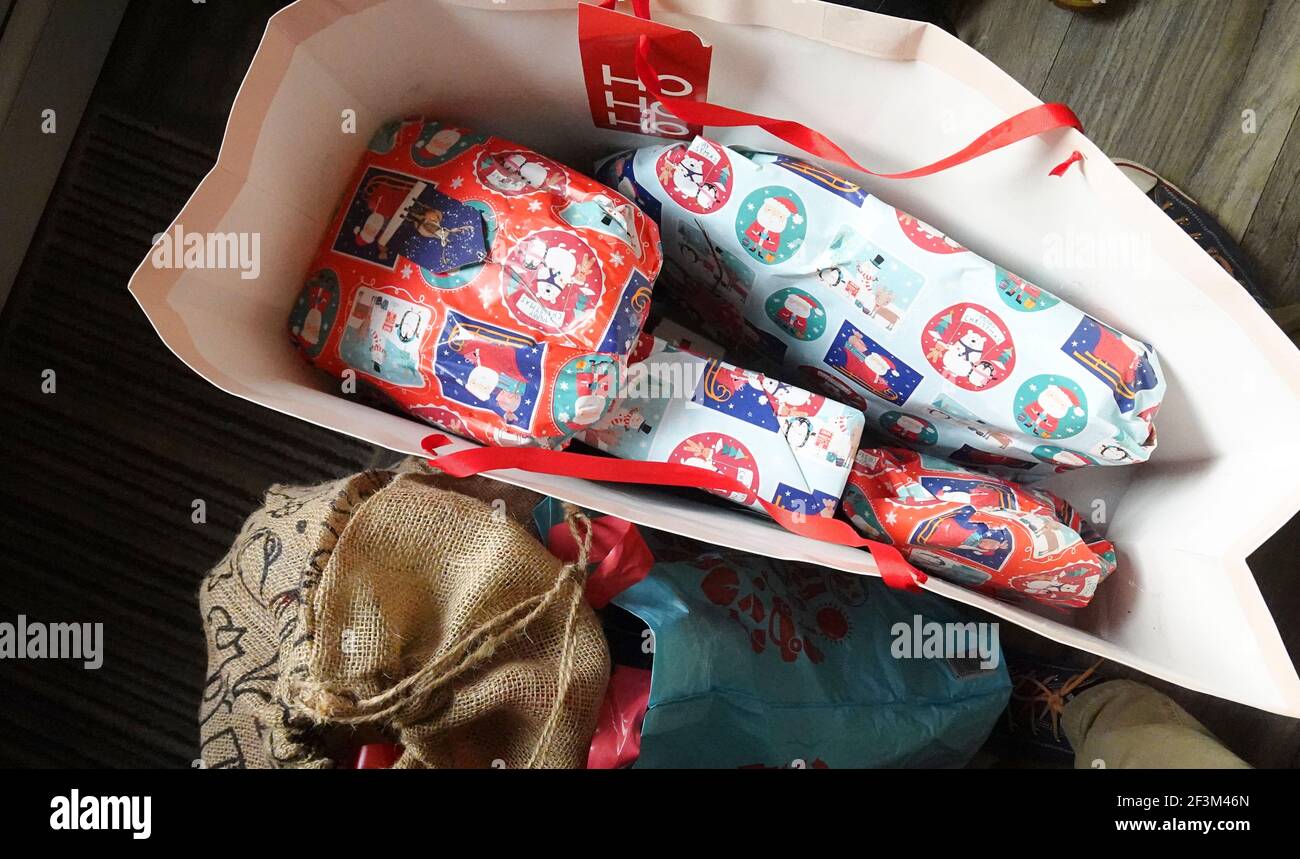 Top view of Christmas gift bag with wrapped presents Stock Photo