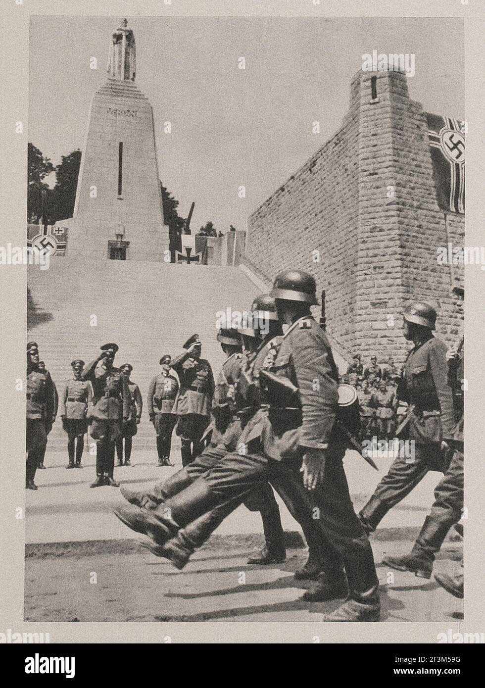 World War II from German propaganda news. Parade of Wehrmacht soldiers in occupied Verdun. France. 1940 Stock Photo