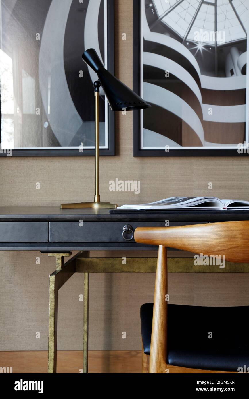 Close up of desk with part of 2 of 3 architectural prints of Guggenheim, New York, in UK show home Stock Photo