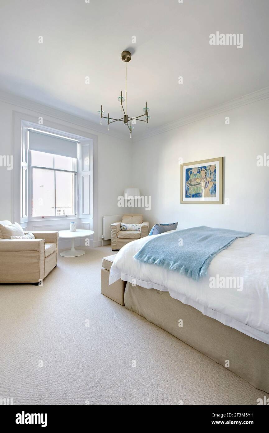 Modern white bedroom in UK home Stock Photo Alamy