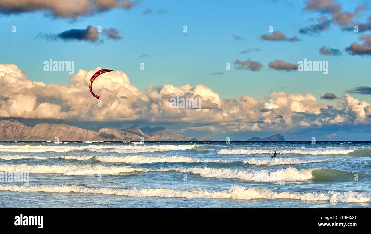 Single kite-surfercatching some waves Stock Photo