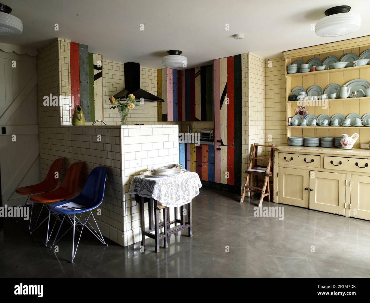 Open plan kitchen with welsh dresser in residential home, UK Stock Photo
