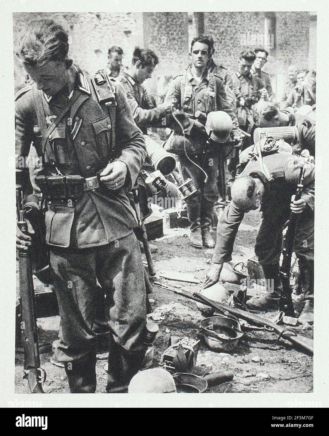 World War II period from German propaganda news. Battle of France. German soldiers during the victory march in France. 1940 Stock Photo