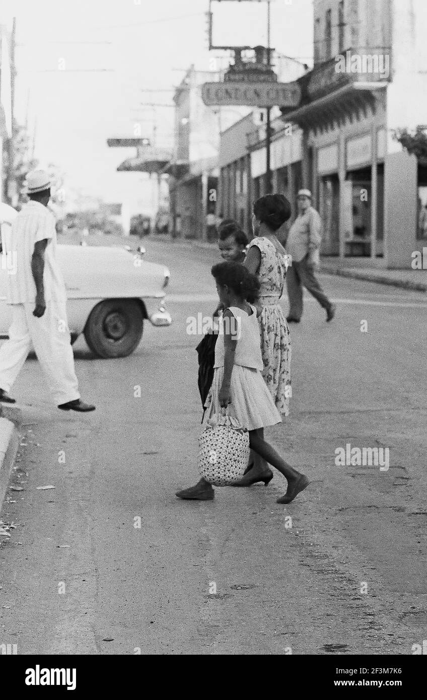 Mother with children on street, Palma Soriano, Cuba, Santiago de Cuba (Cuba : Province), Palma Soriano (Cuba), 1963. From the Deena Stryker photographs collection. () Stock Photo