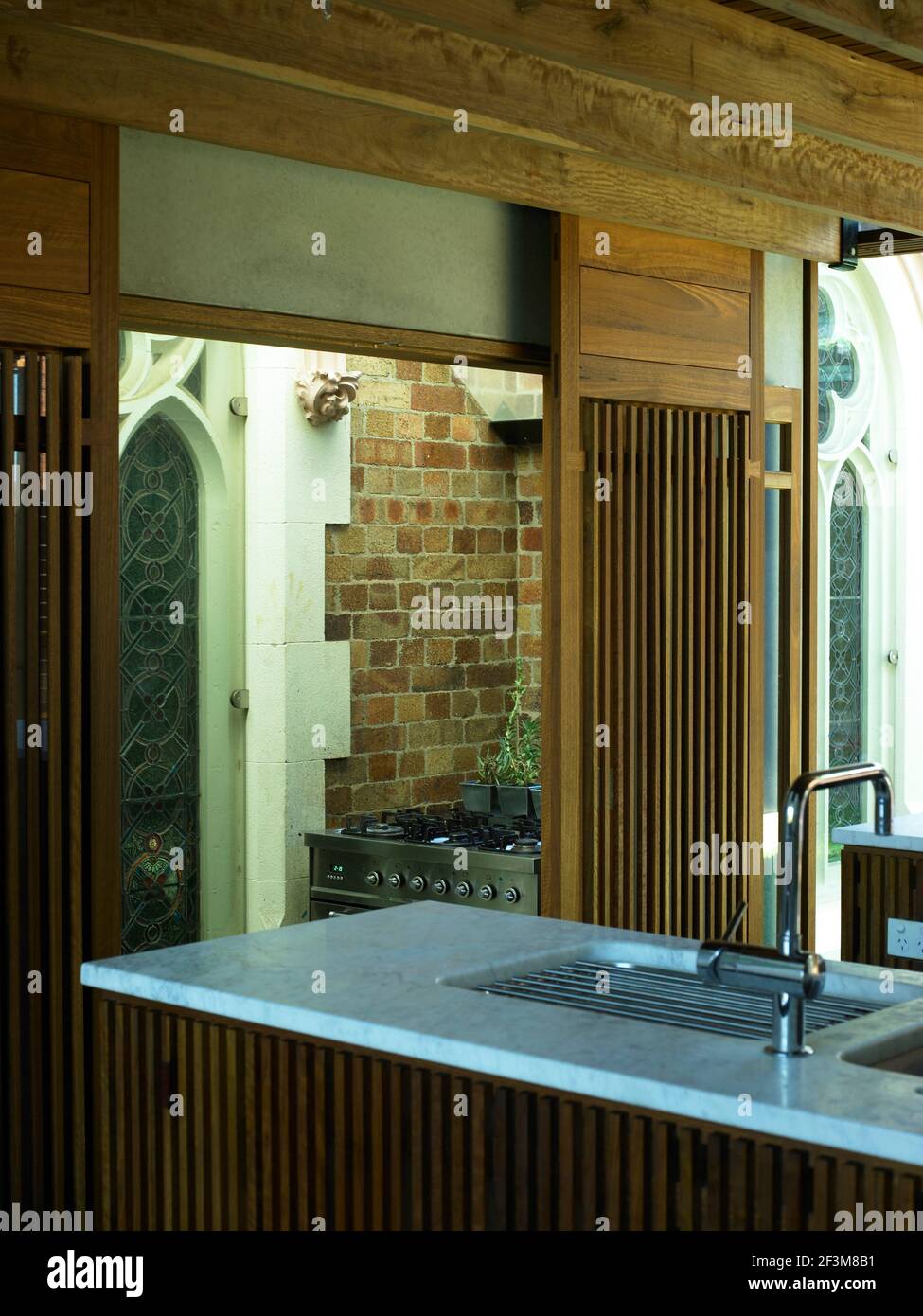 Kitchen with sliding wooden doors in residential house, Queensland