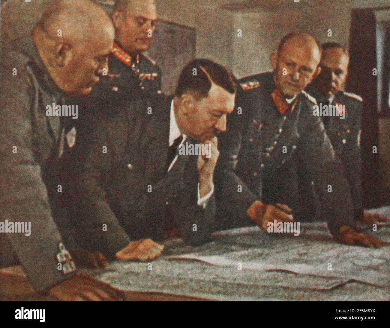 World War II period from German propaganda news. 1942.  At the Fuhrer's headquarters: The Fuhrer, the Duce of fascist Italy, behind them, marshal Keit Stock Photo