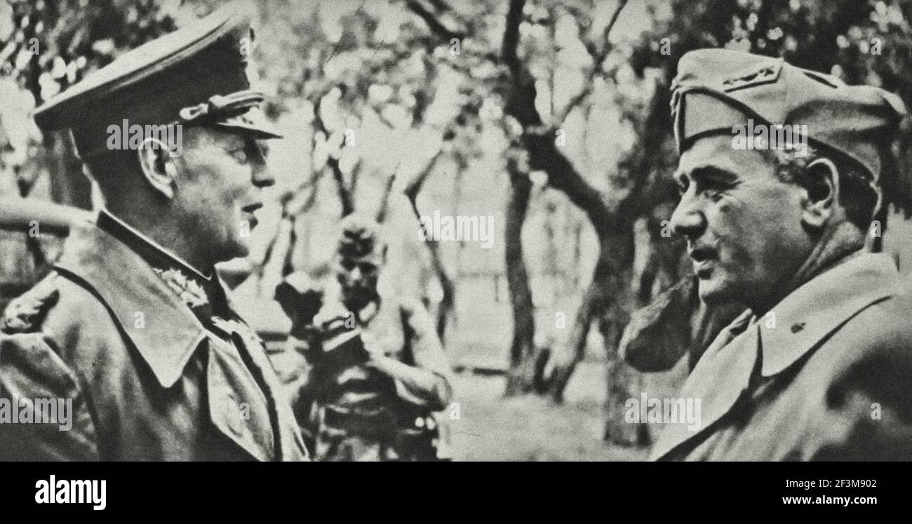 World War II period from German propaganda news. 1941 The first soldiers of two friendly powers: Colonel-General von Kleist, commander of a German mot Stock Photo