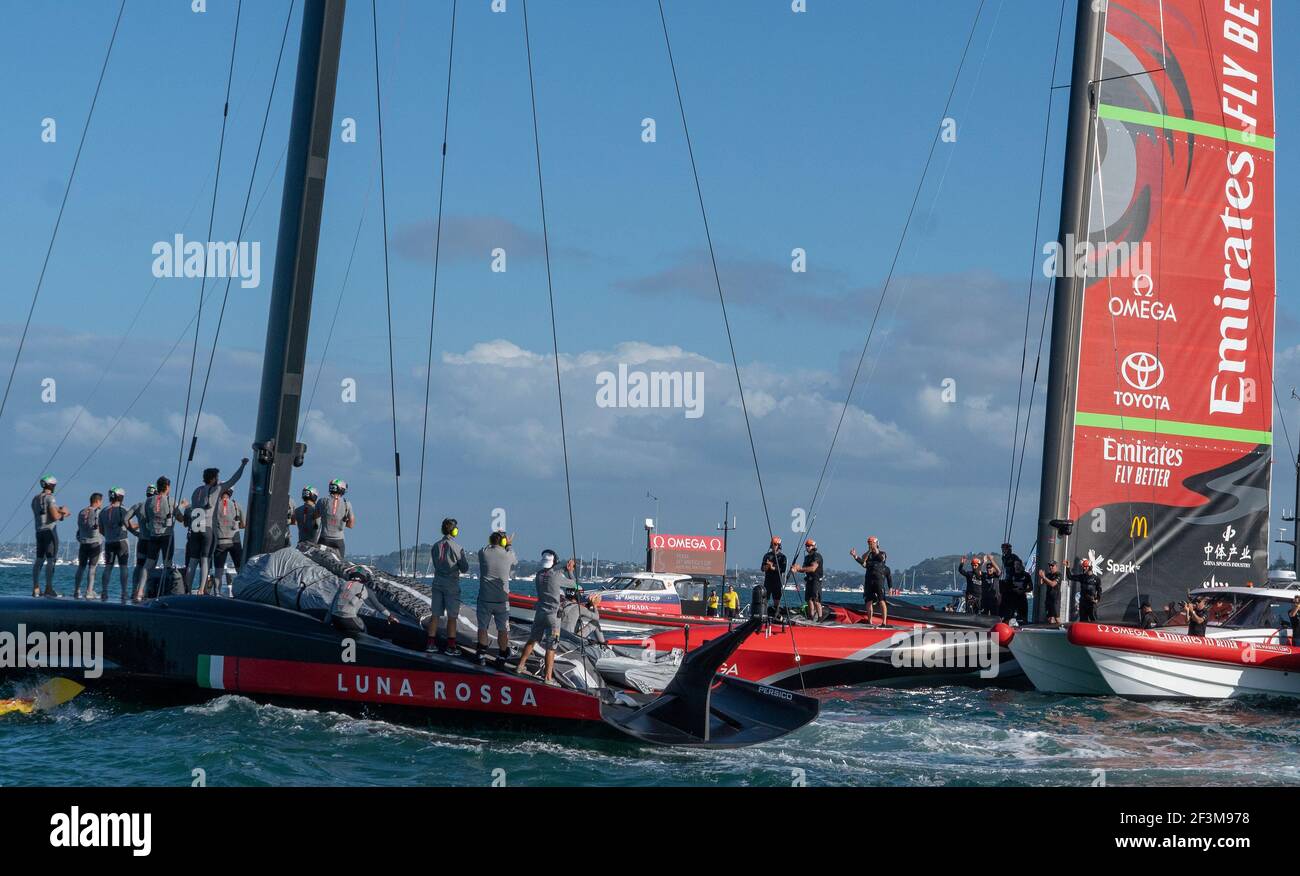 Auckland, New Zealand, 17 March,  2021 -  Italian challengers Luna Rossa Prada Pirelli wave their congratulation to Emirates Team New Zealand, skippered by Peter Burling on Te Rehutai, after the final race of the 36th America's Cup won by Team New Zealand to win the series 7-3.  Credit: Rob Taggart/Alamy Live News Stock Photo