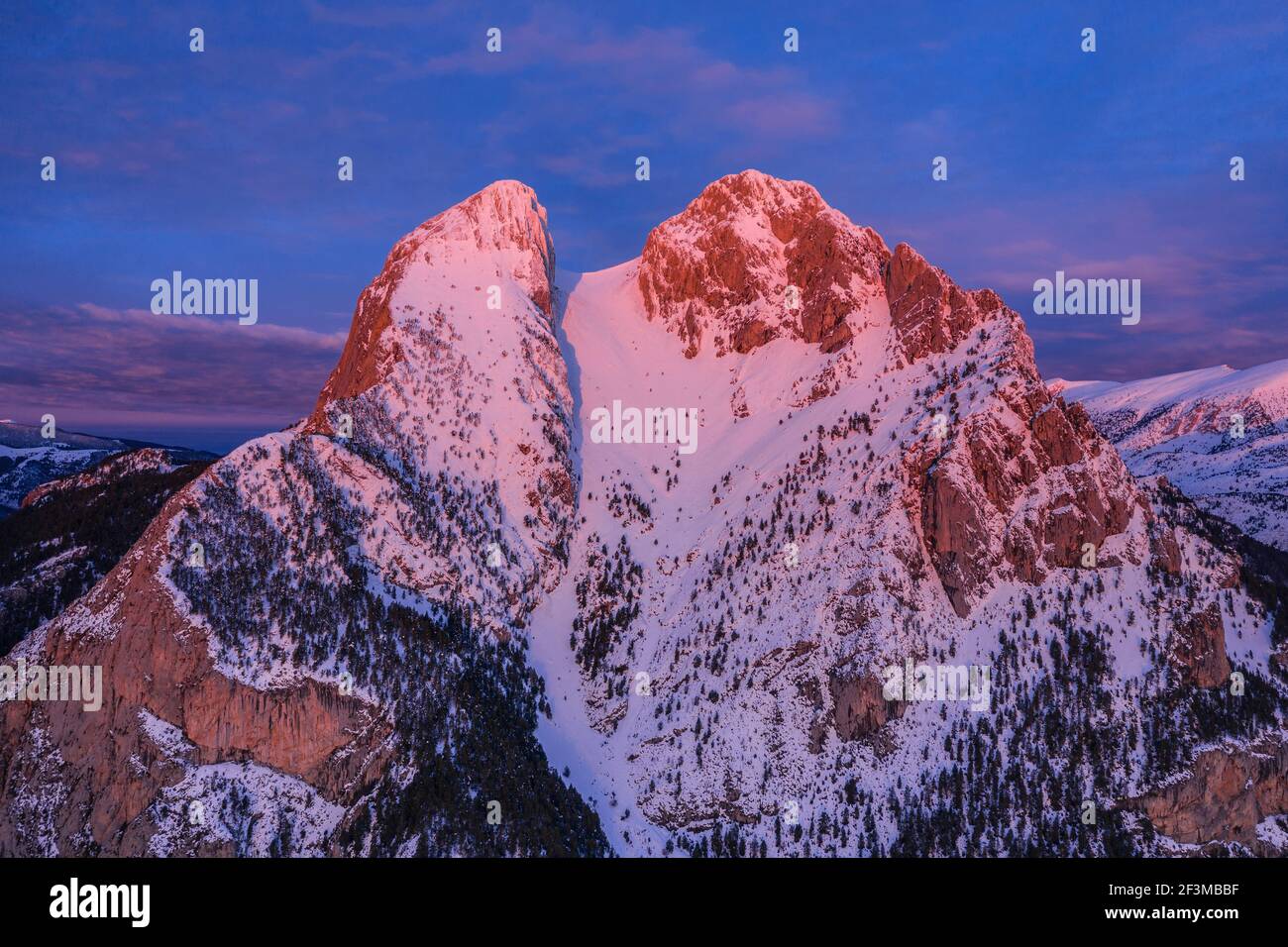Aerial view of Pedraforca at sunrise after a winter snowfall (Barcelona province, Catalonia, Spain, Pyrenees) Stock Photo