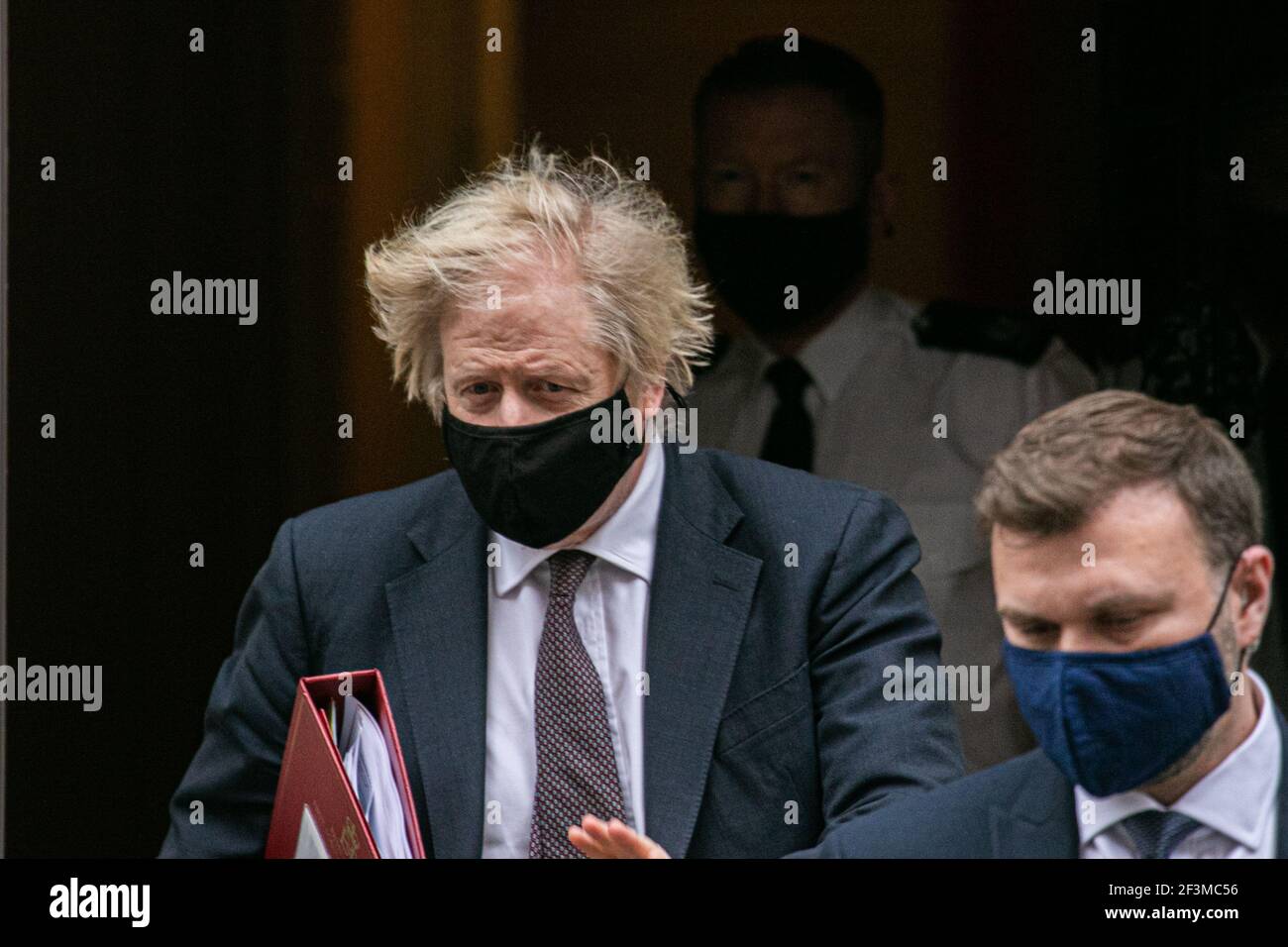 WESTMINSTER  LONDON, UK 17 March 2021. Prime Minister Boris Johnson wearing a protective facemask departs from 10 Downing Street for Parliament to attend the weekly PMQs Prime Minister Questions as his government plans to introduce new powers to crack down on protests.  MPs have voted to pass the  Police, Crime, Sentencing and Courts Bill at  the second reading after two days of debate in the House of Commons. Credit amer ghazzal/Alamy Live News Stock Photo