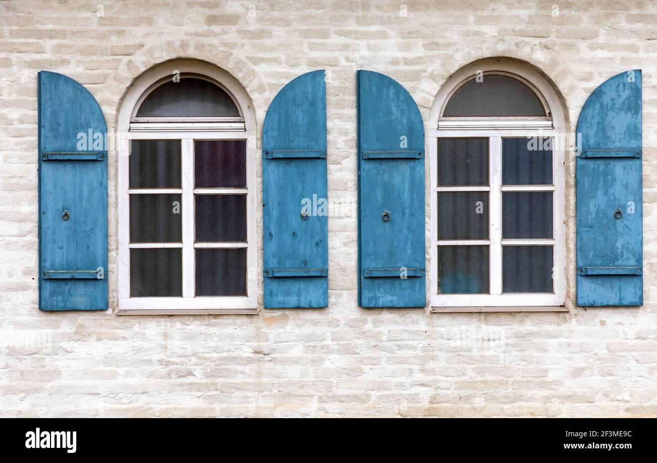 Window with wooden shutter on an old building Stock Photo