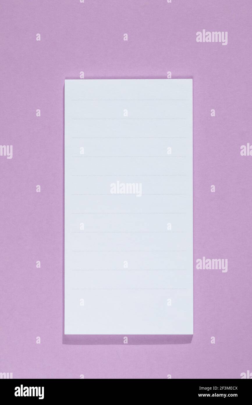 empty note isolated on purple background. space for text, mock up ...