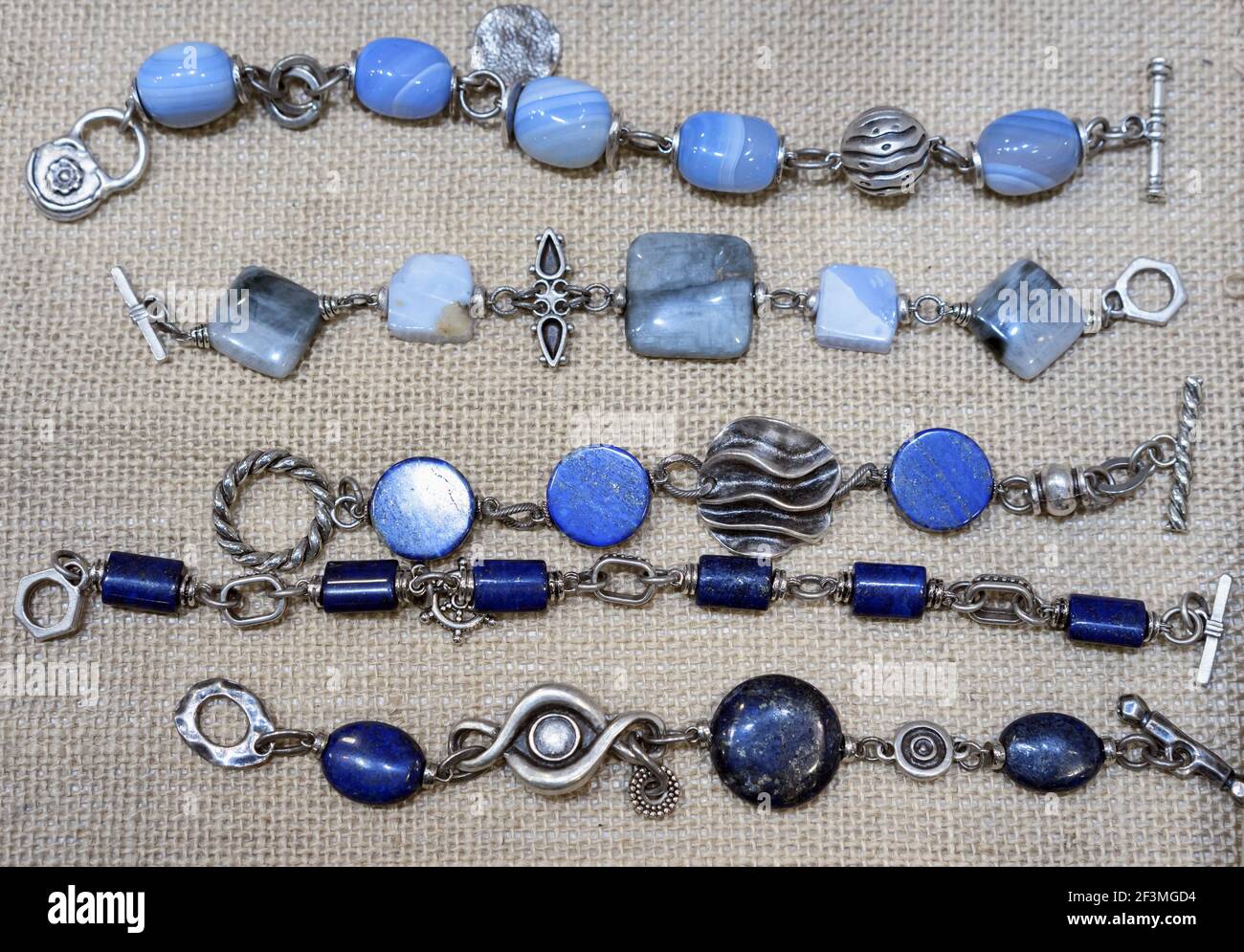 Silver bracelets with natural lapis lazuli, agate and moonstone. Stock Photo