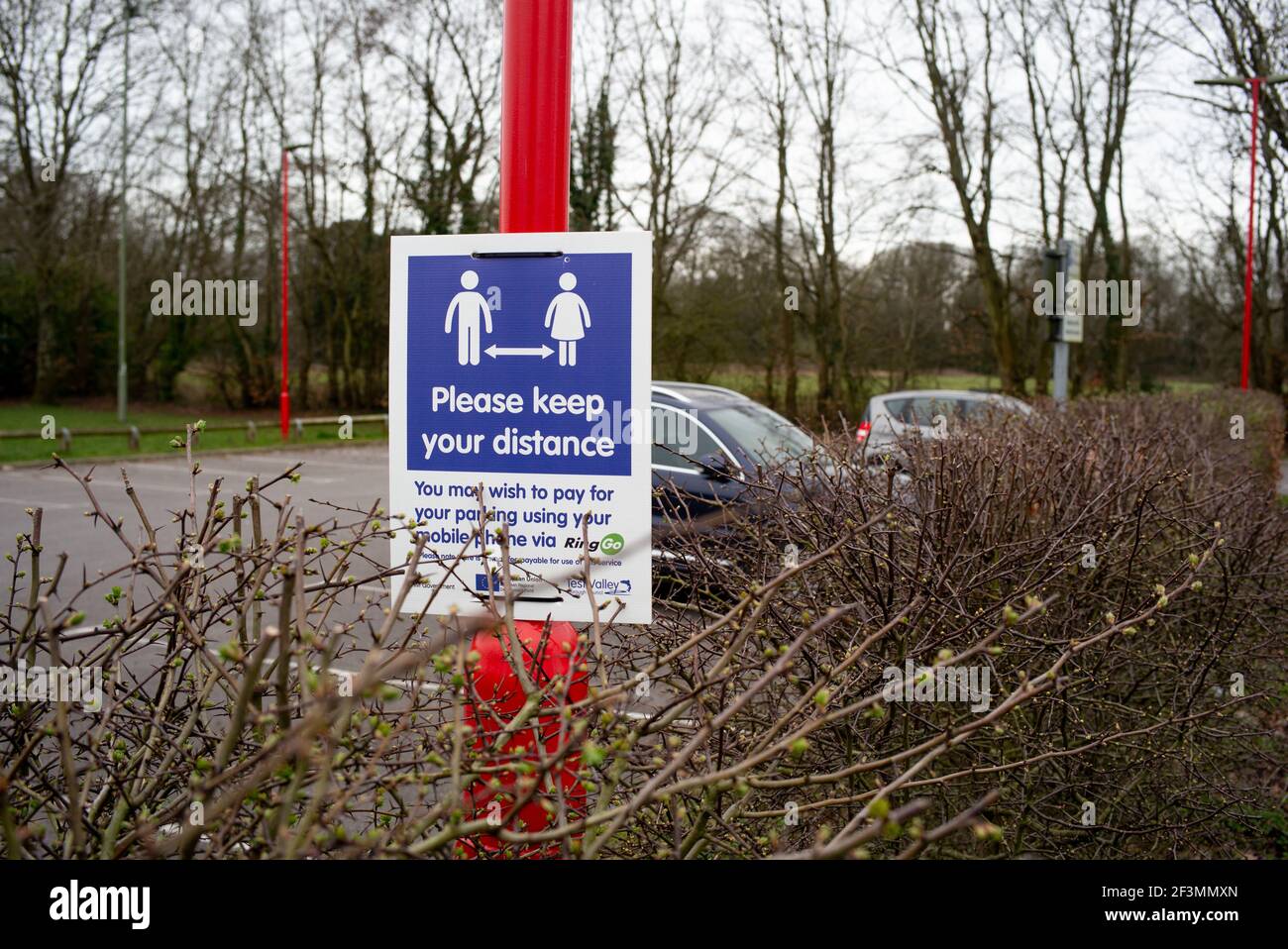 Social distancing sign in a car park in the Hampshire town of Romsey. Stock Photo