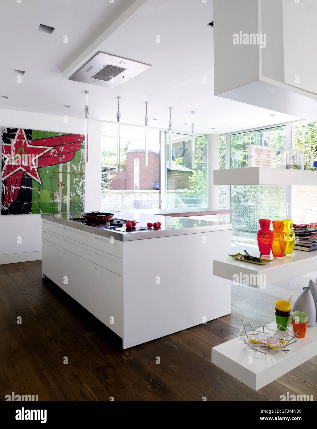 Modern kitchen with central island unit in UK home Stock Photo