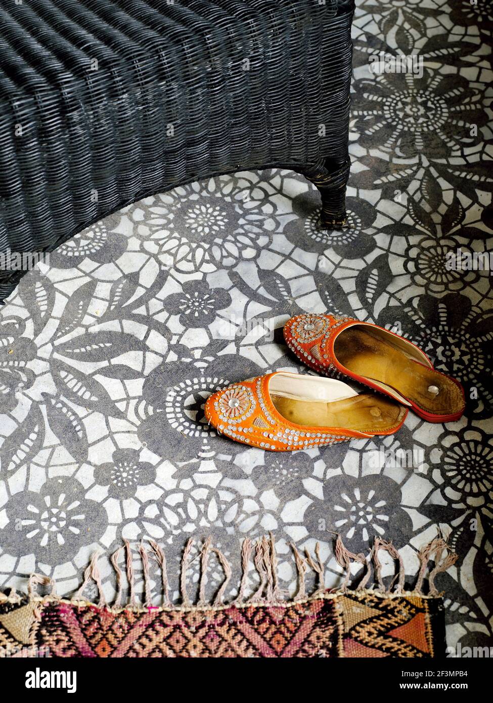 Pair of slippers on floral pattern floor in Moroccan home Stock Photo