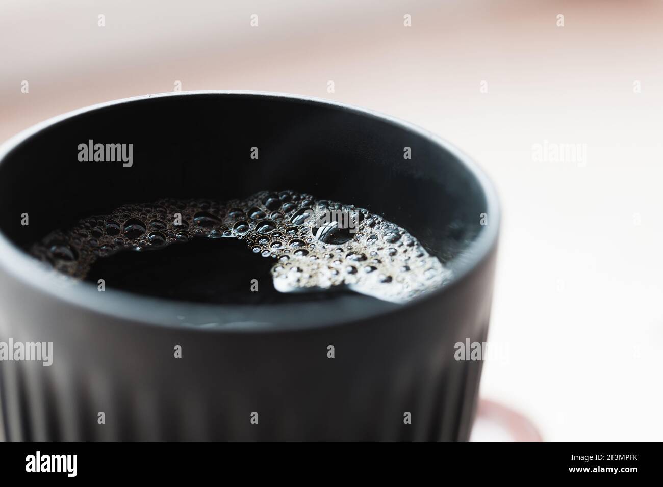 Black cup of filter coffee, close up photo with selective soft focus Stock Photo