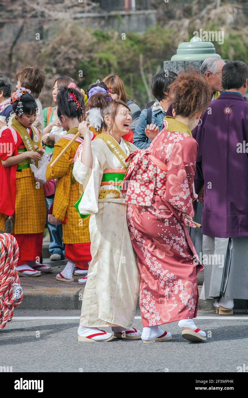 Young Japanese females dressed in kimonos fooling around at the annual  Yayoi Matsuri to celebrate the start of spring, Nikko, Japan Stock Photo -  Alamy