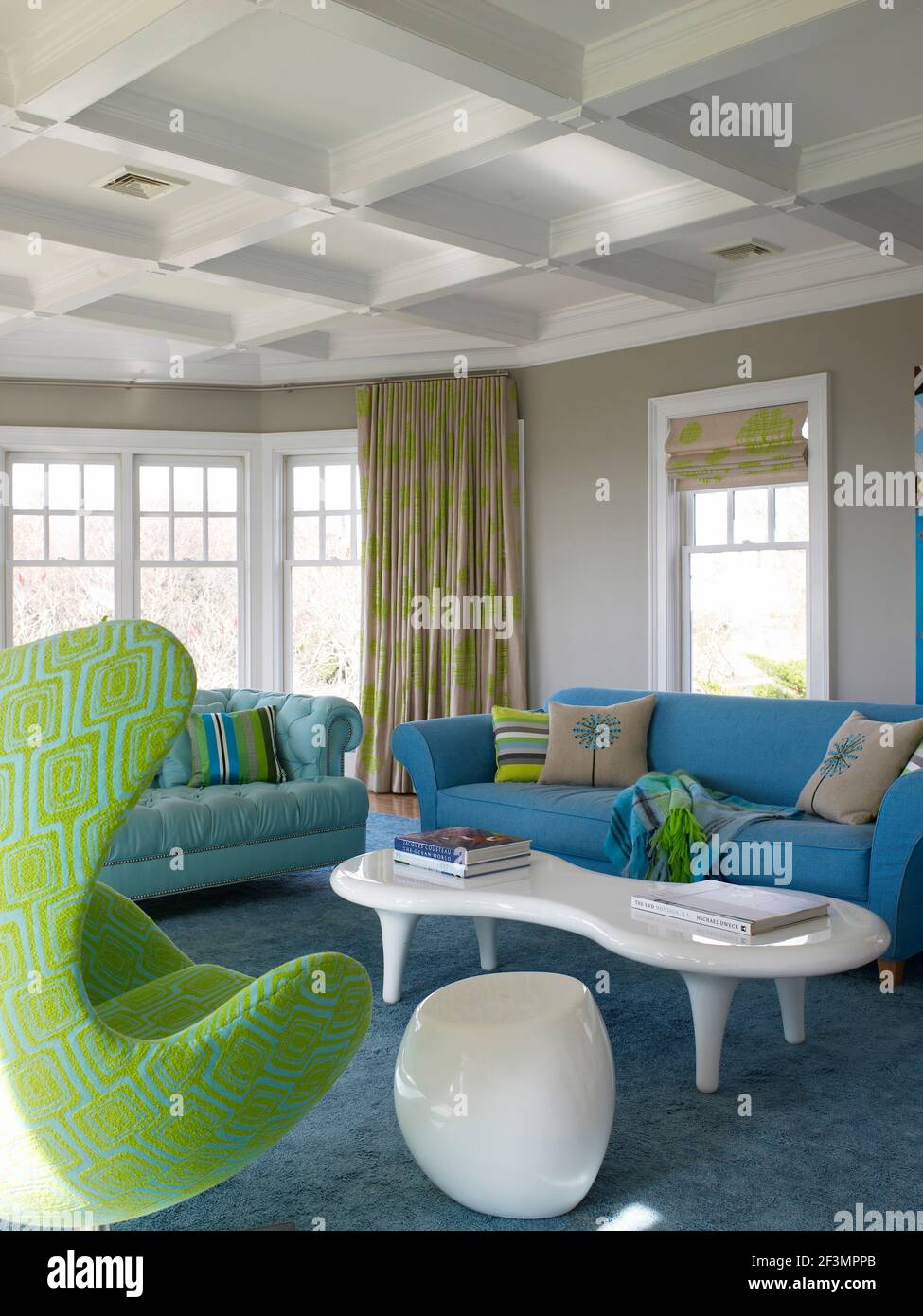 Blue furniture in living room in New York home Stock Photo Alamy