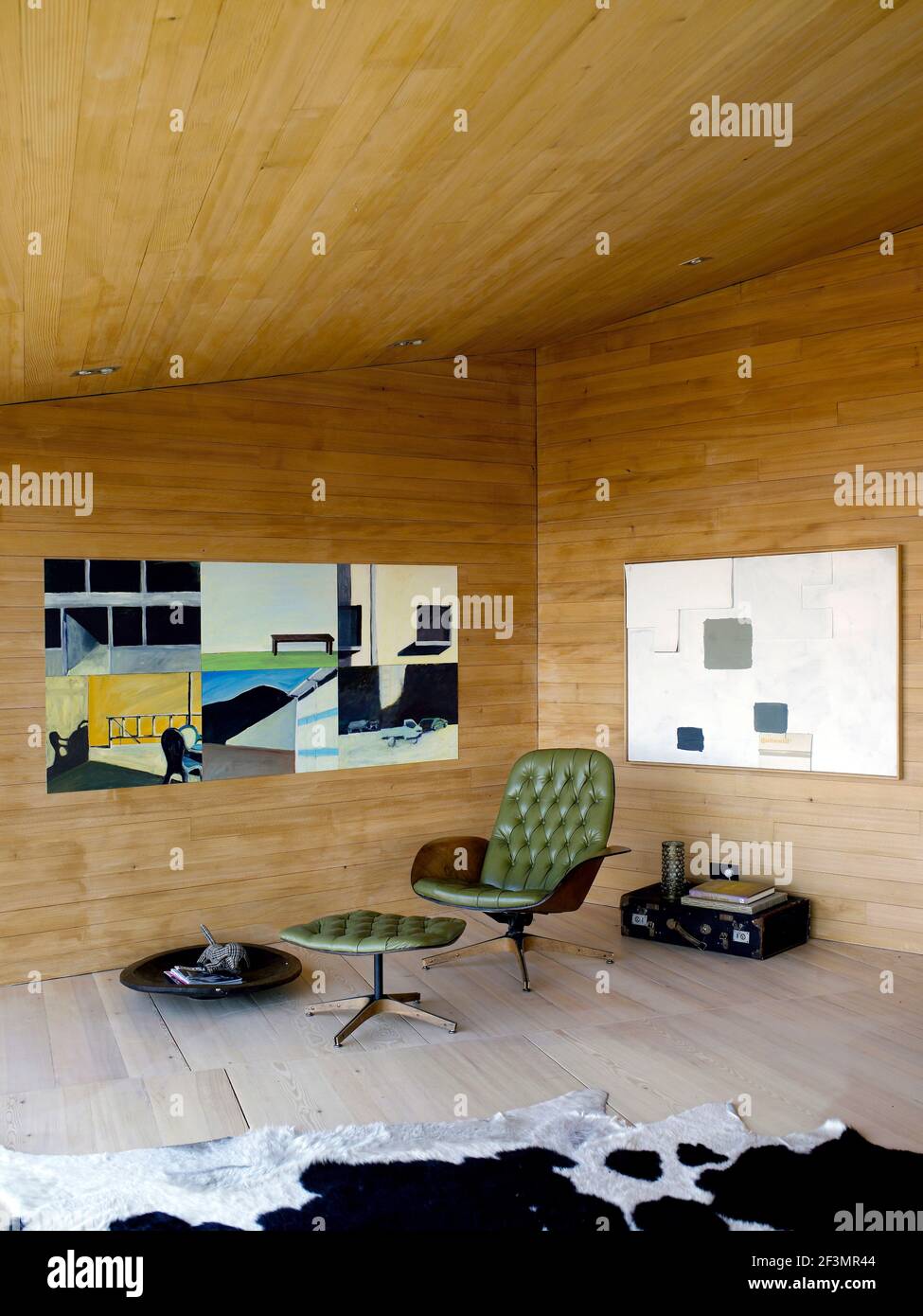 Chair in corner of room with wood panelling in Austrian home Stock