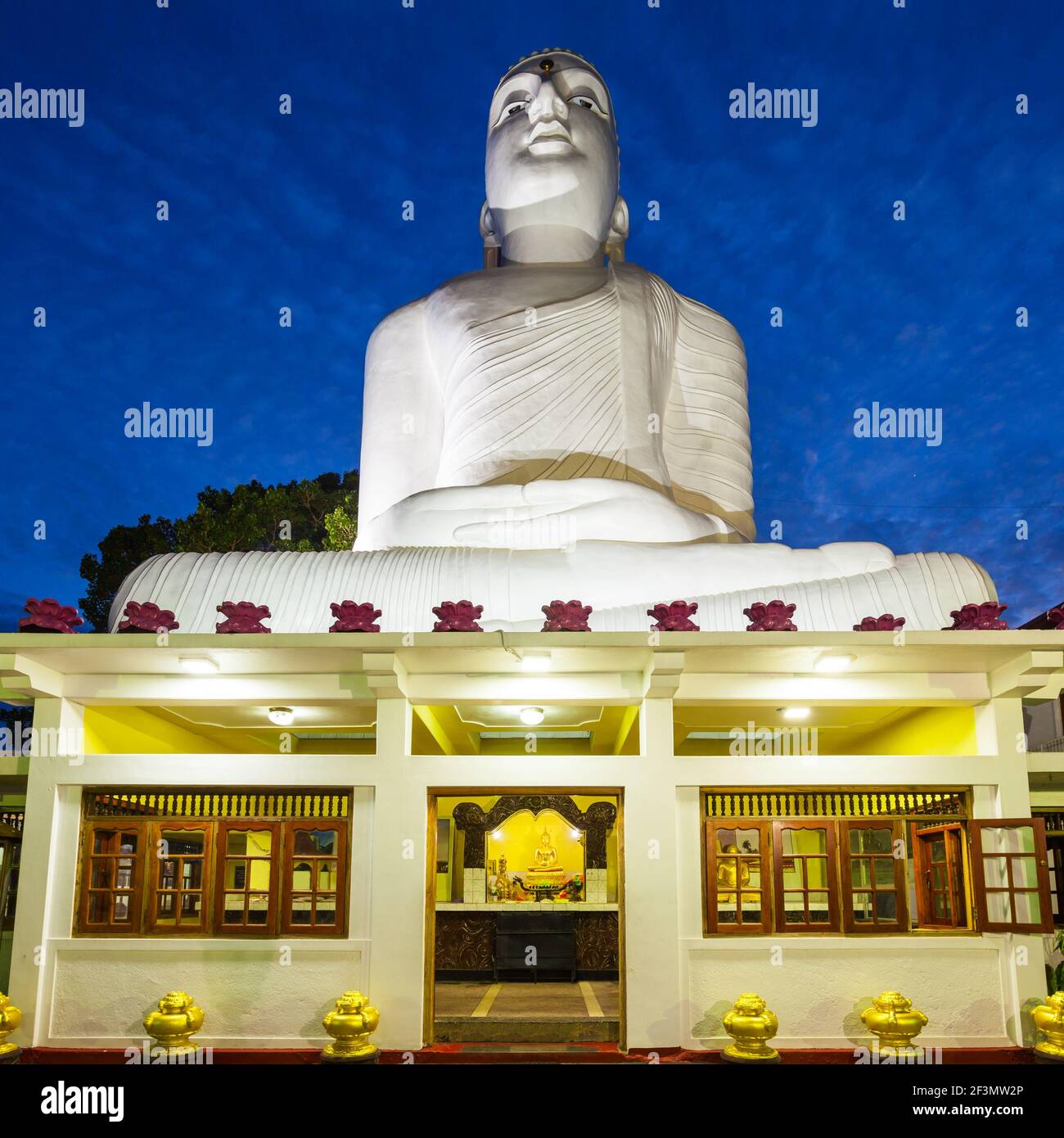 Bahirawa Kanda or Bahirawakanda Vihara Buddha Statue in Kandy, Sri Lanka at sunset. Bahirawakanda is a giant samadhi buddha statue on the top of the m Stock Photo