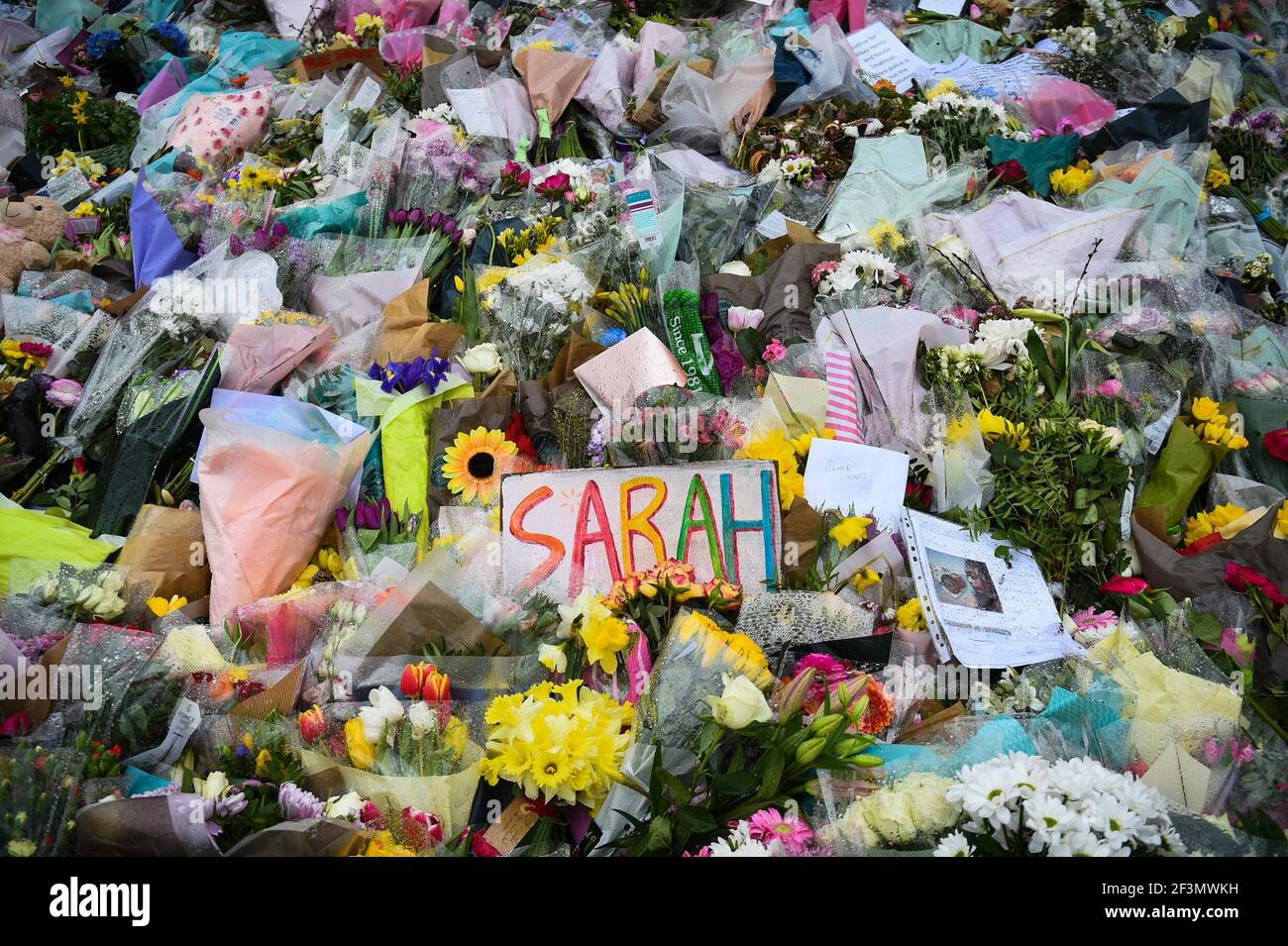 Floral tributes left next to the bandstand in Clapham Common, London, for Sarah Everard. Pc Wayne Couzens, 48, appeared at the Old Bailey in London charged with the kidnap and murder of the 33-year-old. Picture date: Tuesday March 16, 2021. Stock Photo
