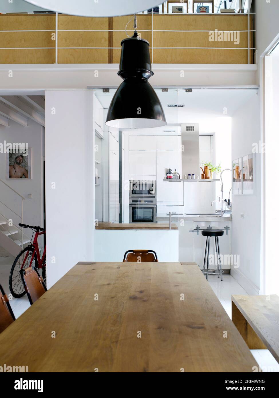 Table and chairs in spacious open plan kitchen in Spanish home Stock