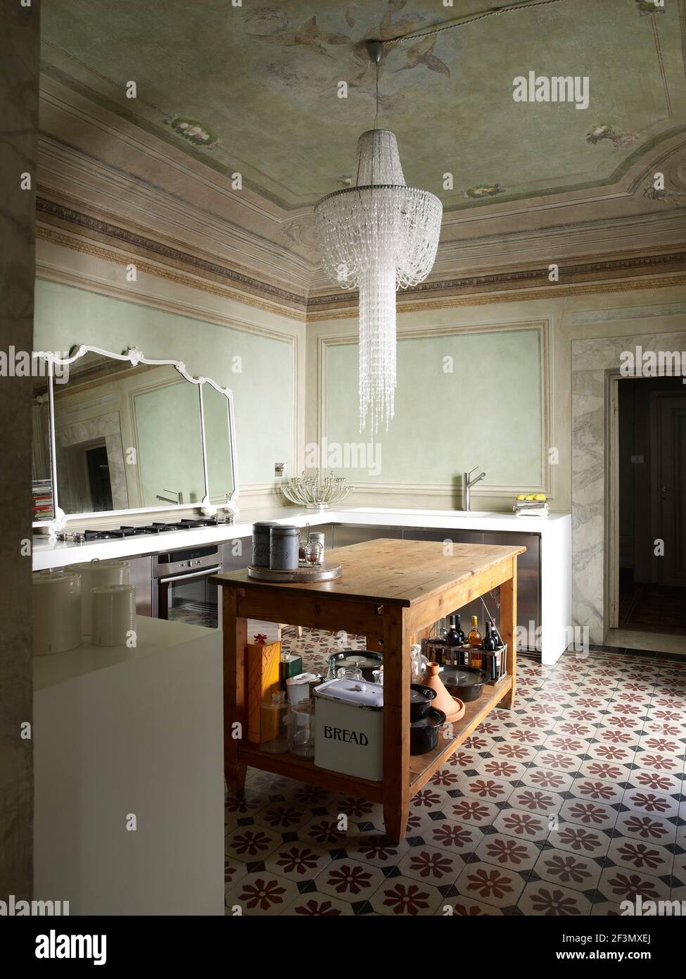 Modern kitchen unit in traditional room in Italian home Stock Photo - Alamy