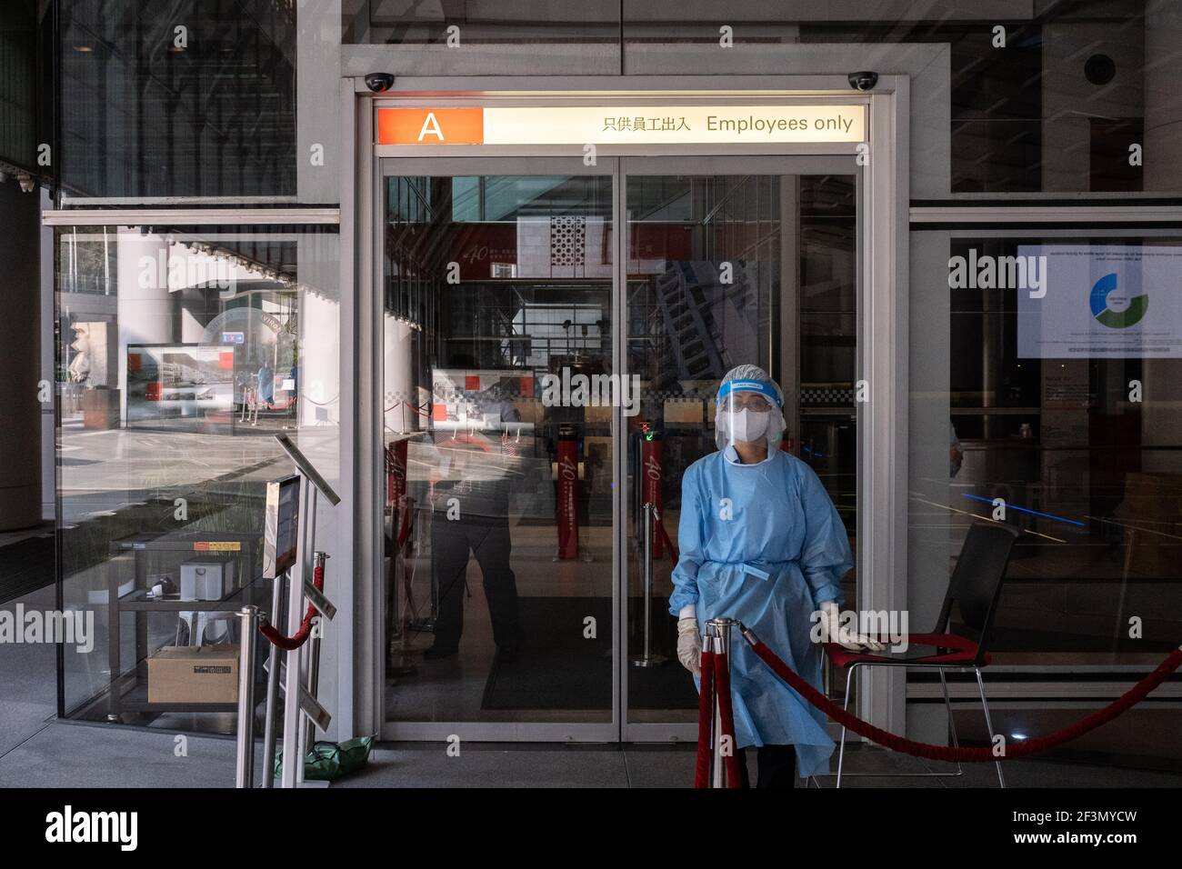 Hong Kong, Hong Kong. 17th Mar, 2021. A worker wearing a personal