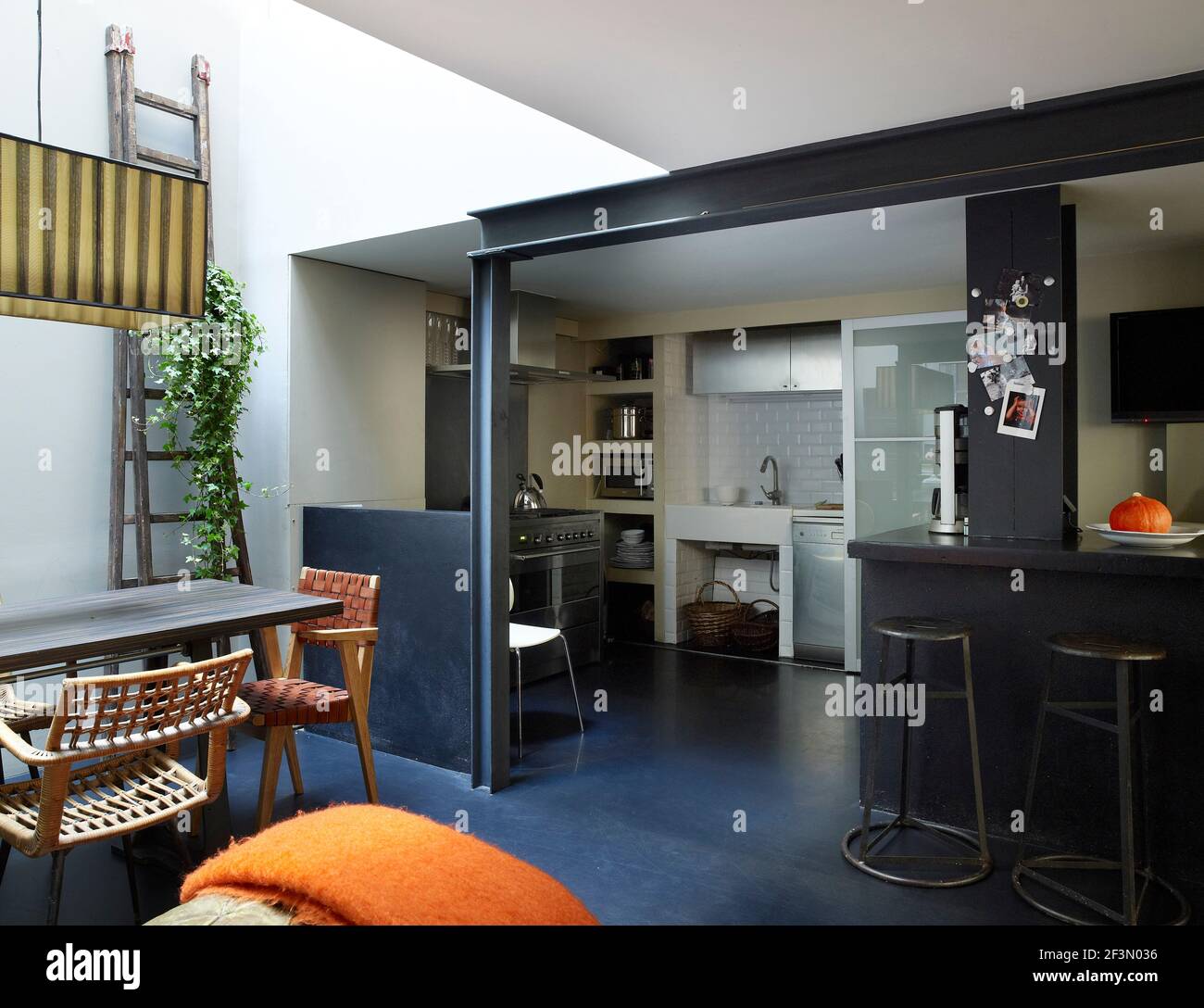 Open plan kitchen with breakfast bar in French home Stock Photo - Alamy