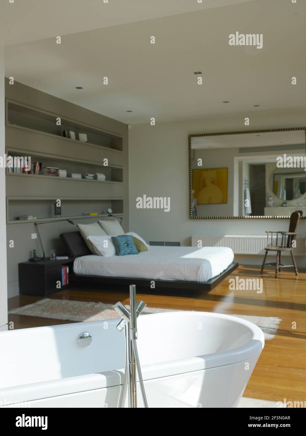 Freestanding bathtub in bedroom in Australian home Stock Photo Alamy